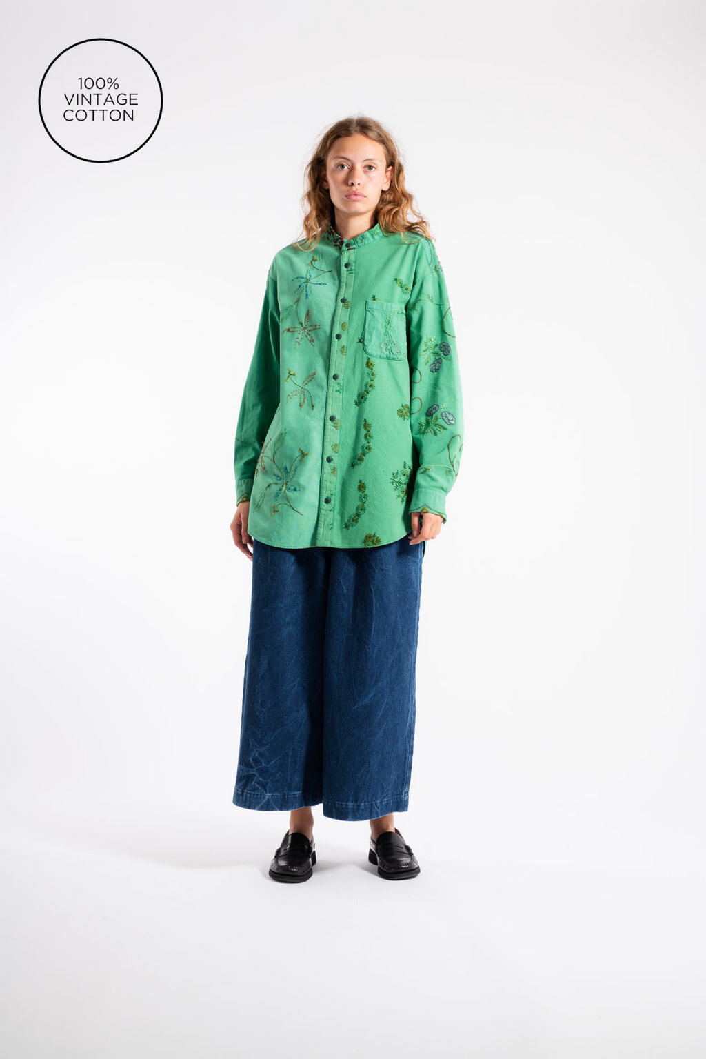Woman wear green shirt with embroidery from Anntian